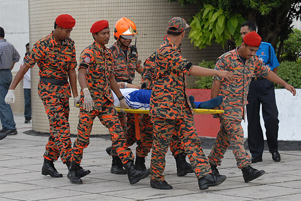Menara Komtar 2007 - Malaysian BASE jumper with back injuries stretchered away after crashing in with oversized parachute.